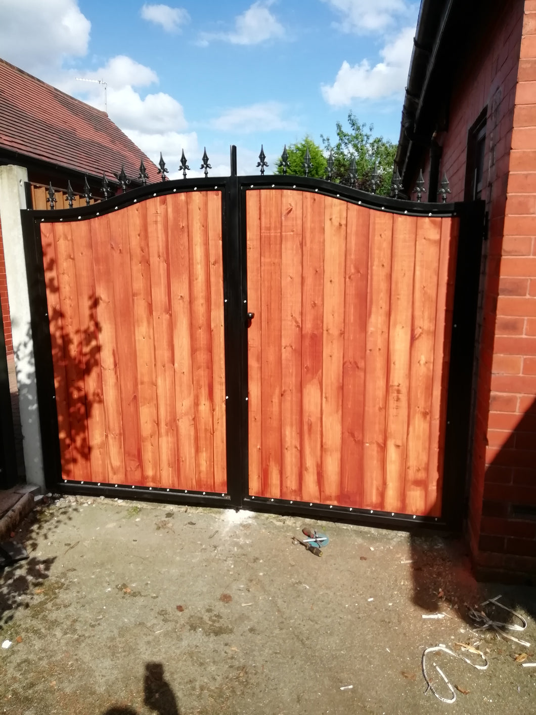 BRAND NEW curved top iron and wooden gate with railheads. Steel and timber gate